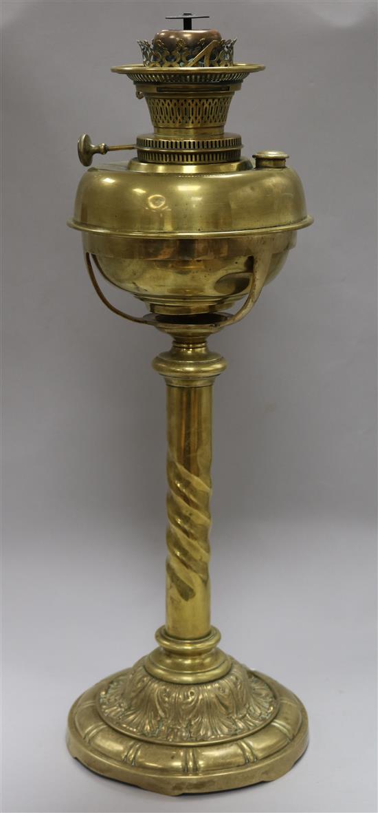 An Edwardian brass oil lamp with later shade